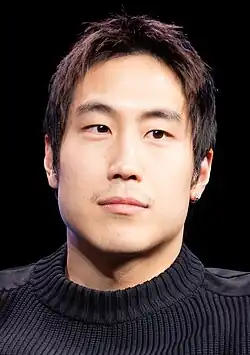 Young Mazino looking towards the camera
