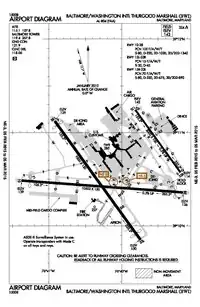 A map with a grid overlay showing the terminals runways and other structures of the airport.