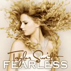 The cover artwork of Taylor Swift's 2008 album Fearless, showing Swift's side profile with blonde curly hair. An action shot, her hair appears to burst outwards.