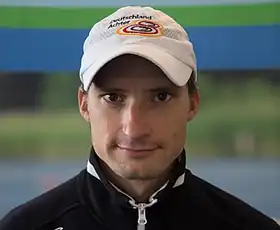 portrait photo of a man wearing a cap