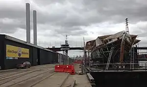 Alma Doepel on custom made barge undergoing hull work as part of complete restoration. Docklands, Victoria, Australia.
