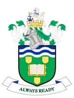 Coat of arms: knight's helmet above shield containing open book, motto "always ready" below.