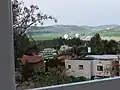 موشاو اویعزر با چشم‌انداز دره الاه