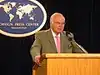 Michael Novak behind a lectern, speaking at the Foreign Press Center in Washington
