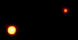 Pluto and Charon as seen by the Hubble Space Telescope w/ FOC