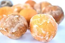 A variety of powdered and glazed donut holes